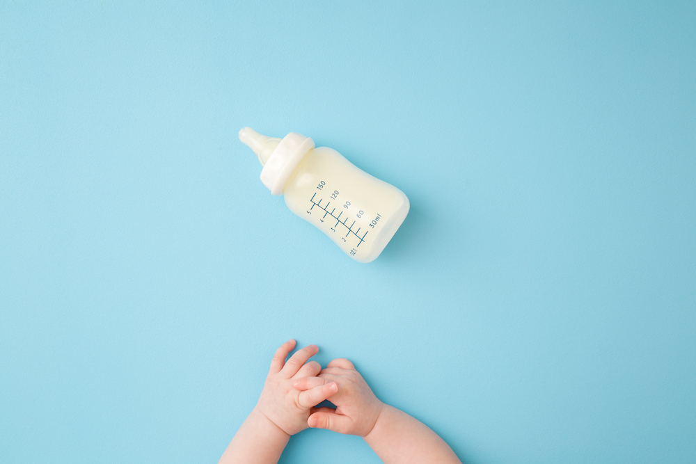 Baby hands and bottle